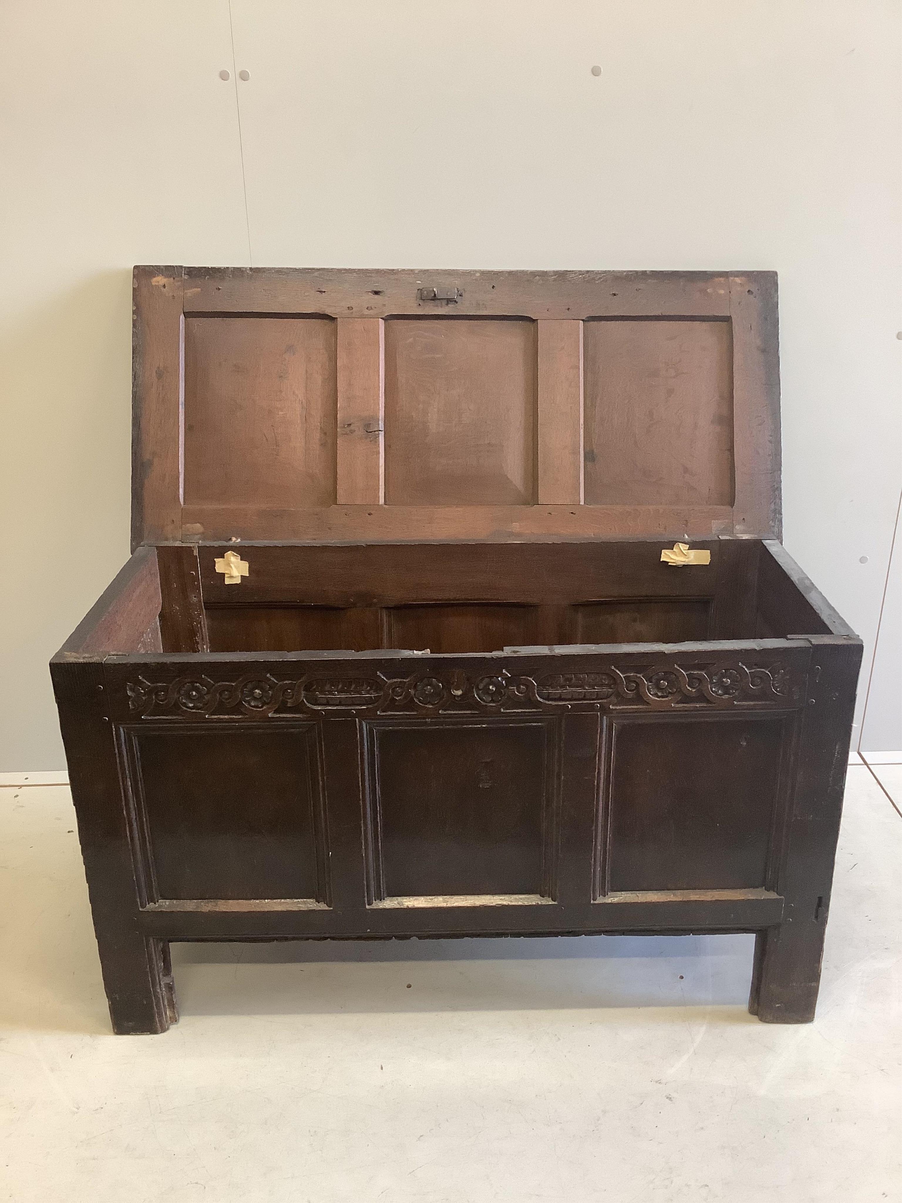 A late 17th century oak coffer three panel top, width 102cm, depth 50cm, height 165cm